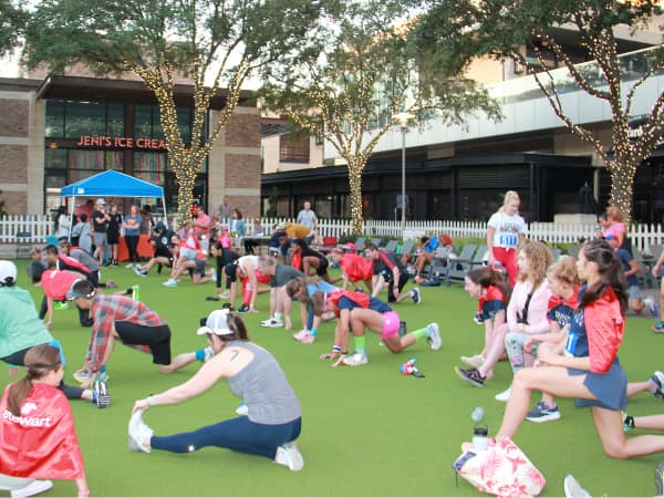 Participants stretch for Superhero Run